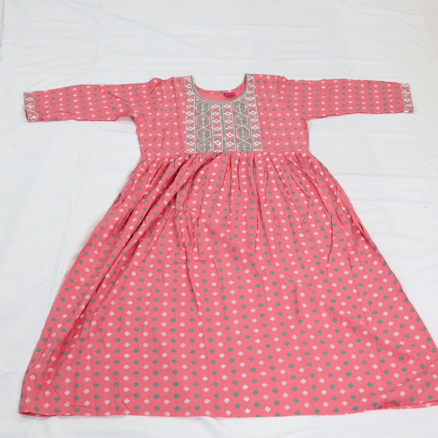 Delicate Charm: Pink Kurti with Embroidered Neckline