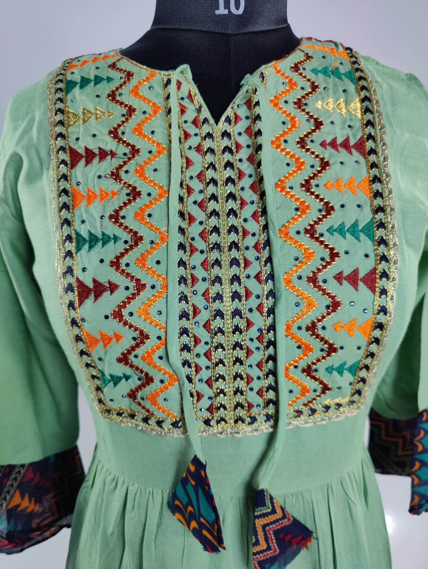 Springtime Serenity: Mint Green Embroidered Kurti with Tiered Hem