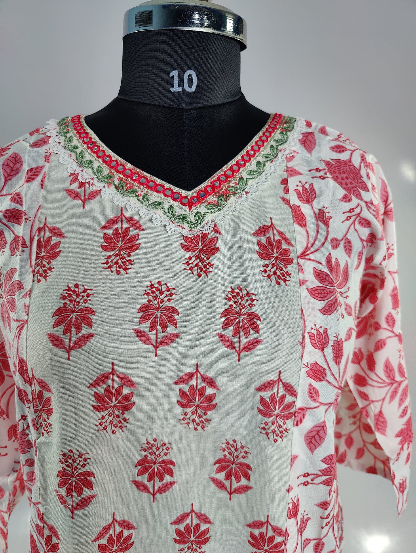 Subtle Elegance: White and Pink Floral Kurti with Embellished Neckline