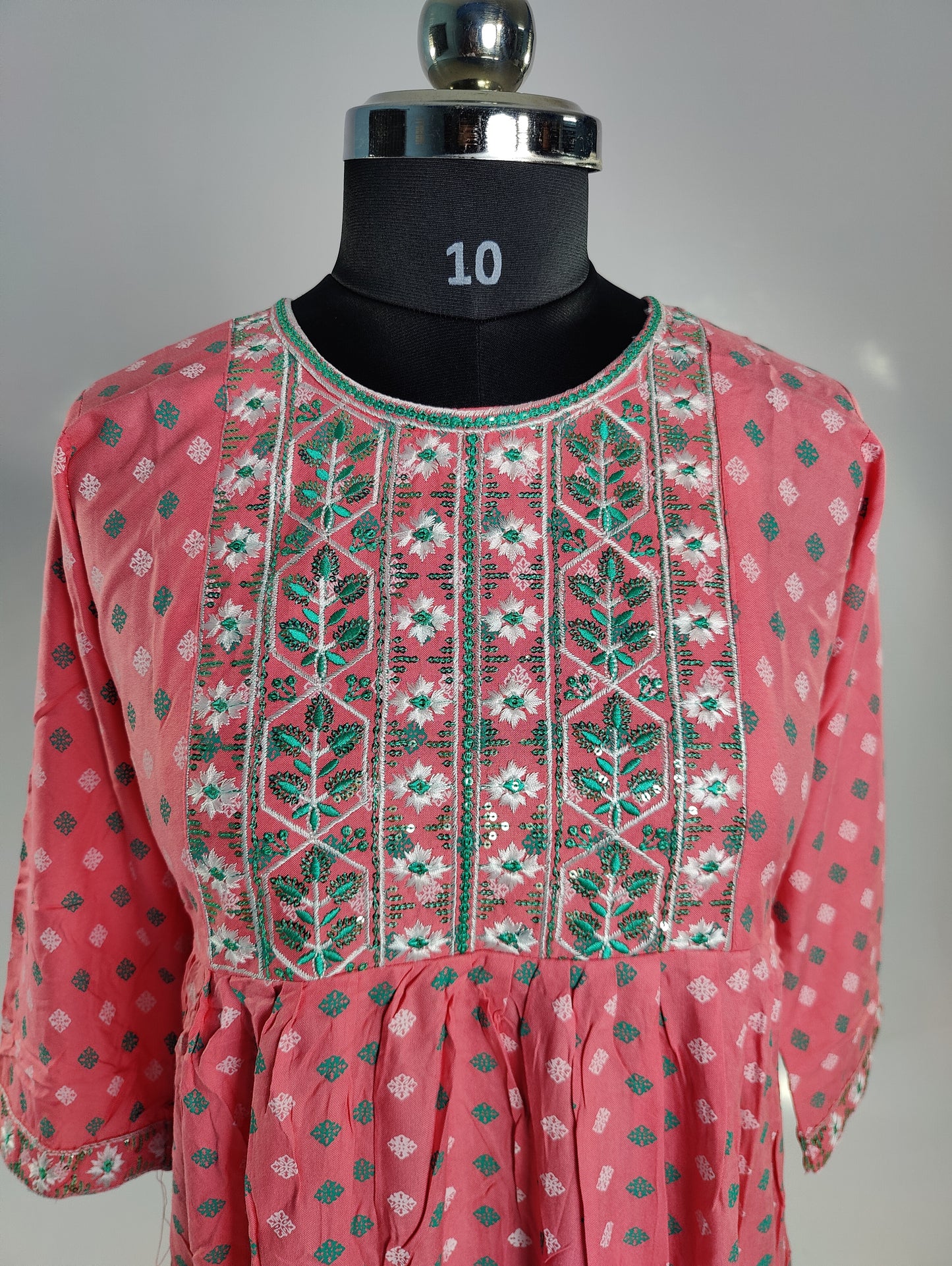 Delicate Charm: Pink Kurti with Embroidered Neckline
