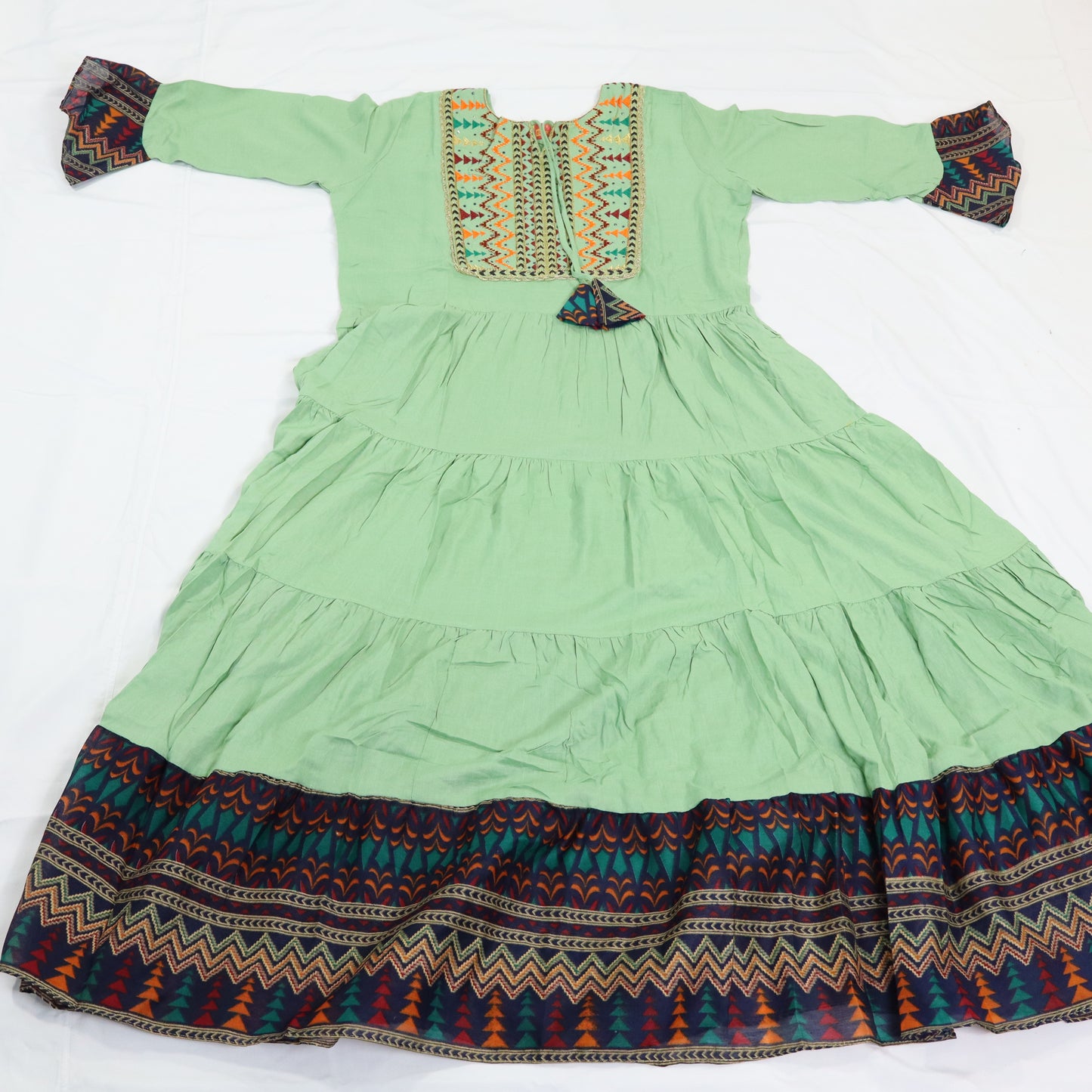 Springtime Serenity: Mint Green Embroidered Kurti with Tiered Hem